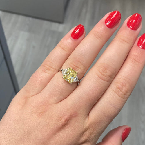fancy yellow diamond ring. 3 carat yellow diamond. Elongated radiant. long radiant yellow diamond. yellow diamond 3 stone ring