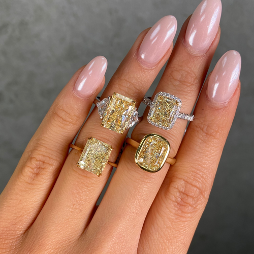 4 large fancy yellow diamond rings