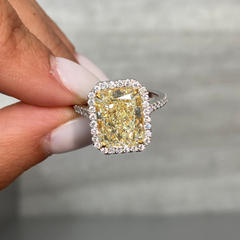 5 Carat Light Yellow elongated radiant cut in halo diamond ring