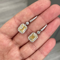Yellow diamond studs. Yellow diamond earrings. Cushion cut diamond earrings. Yellow diamond earrings. Canary yellow diamond earrings. yellow diamond emerald cut.
