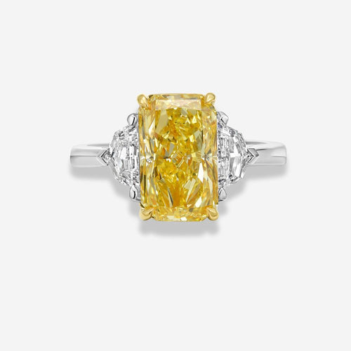 Fancy intense yellow elongated radiant cut ring white background
