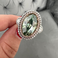 Unique green marquise cut diamond ring featuring a GIA certified diamond.