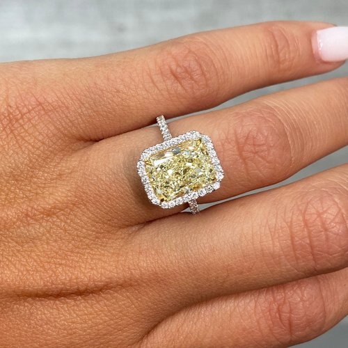 5 Carat Light Yellow elongated radiant cut in halo diamond ring