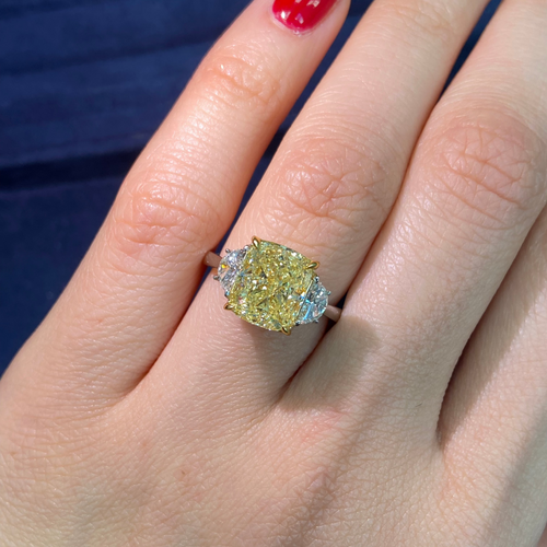 Fancy yellow cushion diamond engagement ring featuring a GIA certified cushion cut diamond.