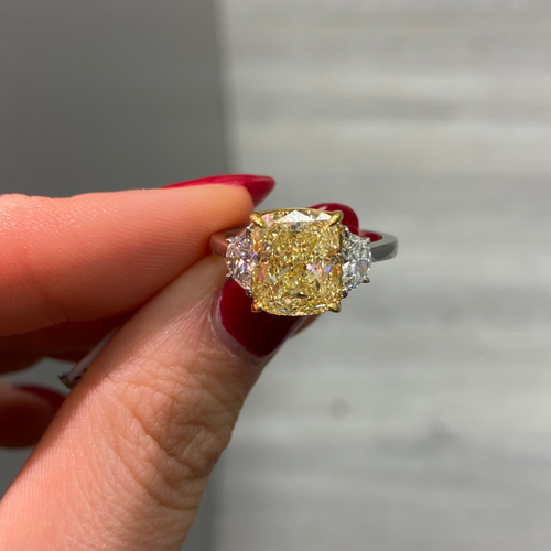 Fancy yellow cushion diamond engagement ring featuring a GIA certified cushion cut diamond.