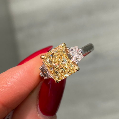 Fancy yellow engagement ring, three stone diamond ring, yellow diamond ring, yellow radiant diamond.