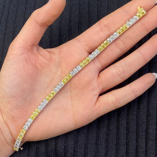 natural yellow and white diamond bracelet on female hand