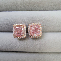 Ethereal pink diamond stud earrings featuring GIA-certified light pink diamonds.