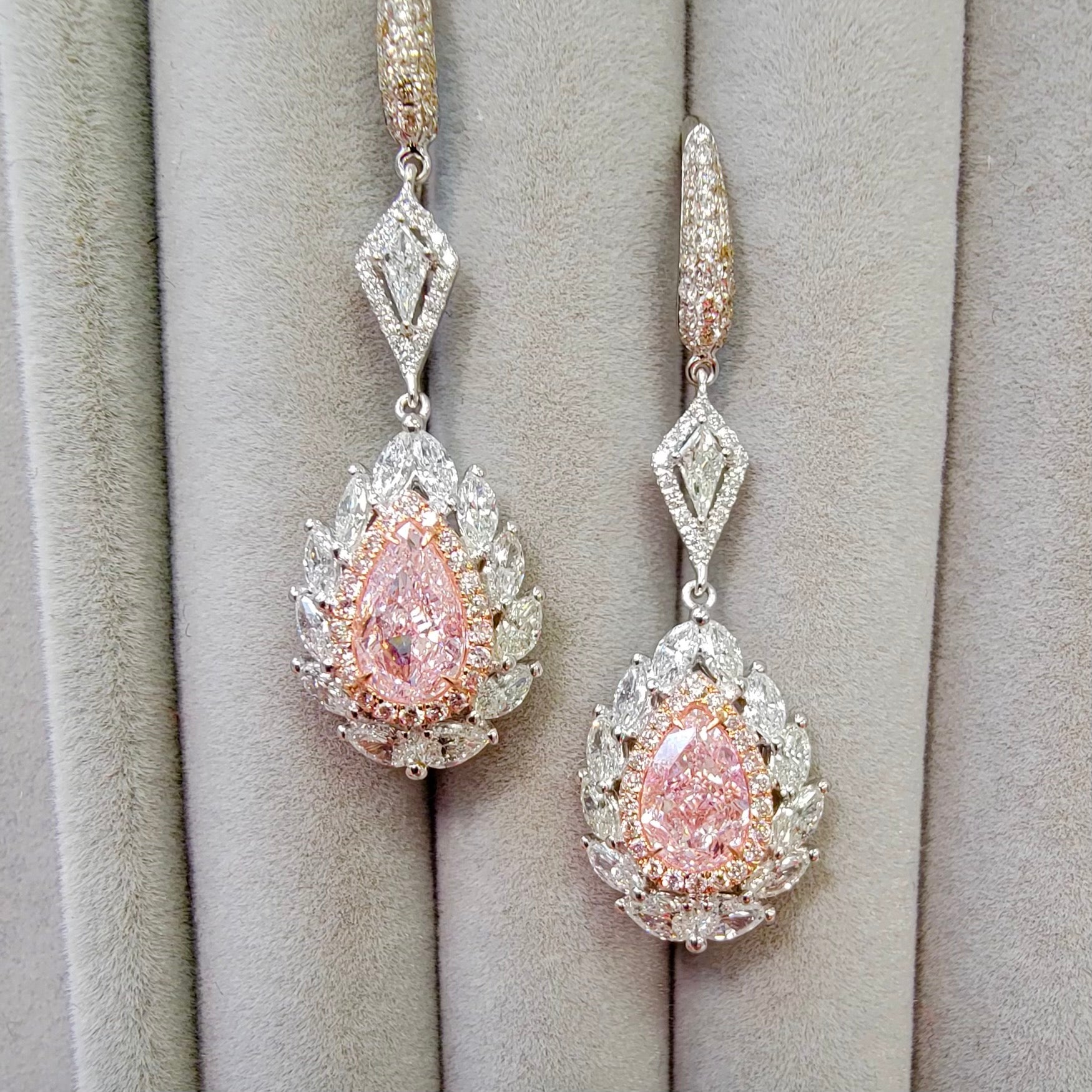 pink diamond earrings. pink diamonds. pink diamond jewelry. pink diamond studs. pink diamond drop earrings. pink and white diamond earrings. pink diamond pear shaoes.