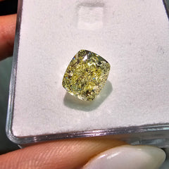 GIA certified fancy yellow cushion cut natural diamond with VS2 clarity and excellent cut.