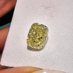 GIA certified Fancy Yellow elongated cushion cut diamond with VS2 clarity.