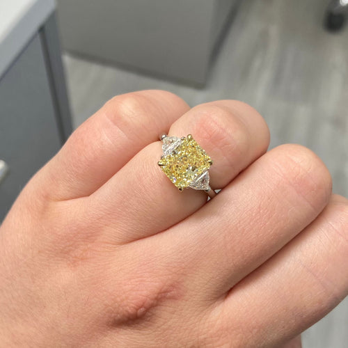 fancy yellow diamond ring. 3 carat yellow diamond. Elongated radiant. long radiant yellow diamond. yellow diamond 3 stone ring
