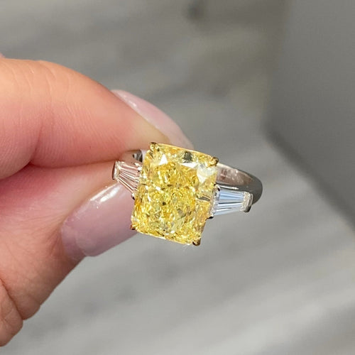  Luxurious yellow elongated radiant diamond engagement ring with a stunning hue with a VVS2 clarity.