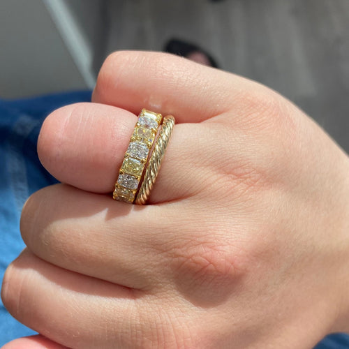 Alternating yellow and white diamond eternity band. Elongated radiant cut. Long radiant cut. Fancy yellow long radiants. Long white diamond radiants. Eternity band. Yellow diamond eternity band. Yellow diamond ring.