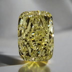 GIA certified light yellow elongated cushion cut diamond with VVS1 clarity.