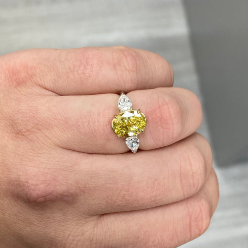 Intense oval diamond ring. Intense yellow diamond. Gia certified intense yellow diamond. Oval diamond ring. Yellow diamond engagement ring. Yellow diamond rings. Yellow diamond jewelry.