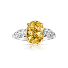 Intense oval diamond ring. Intense yellow diamond. Gia certified intense yellow diamond. Oval diamond ring. Yellow diamond engagement ring. Yellow diamond rings. Yellow diamond jewelry.
