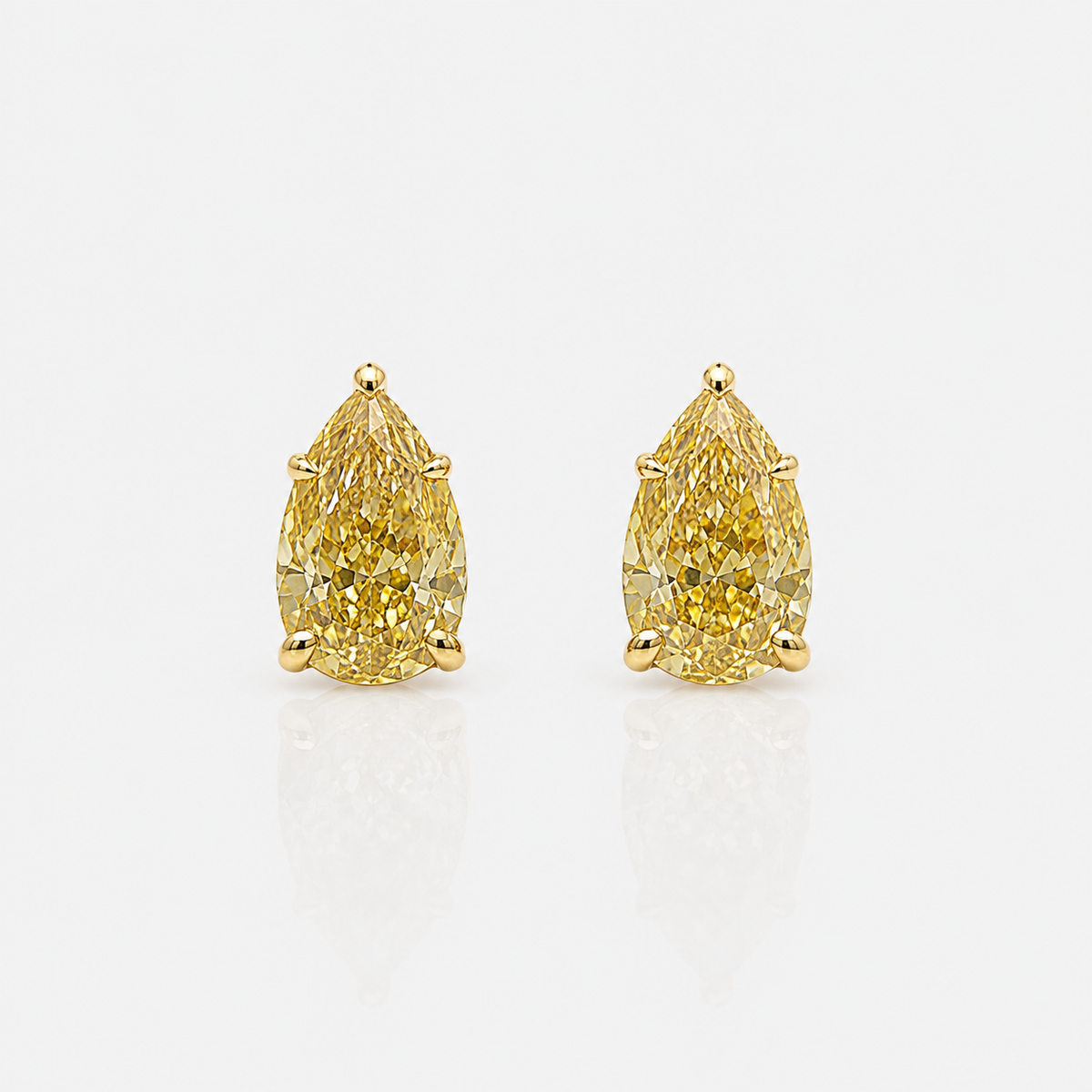 1ct each GIA fancy yellow pear diamond stud earrings | Rare Colors by Namdar, NYC