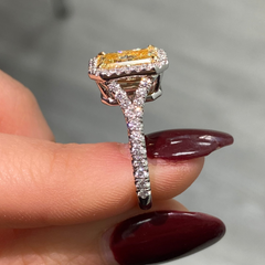 Old money yellow diamond ring with White Halo diamonds with a VS2 clarity.