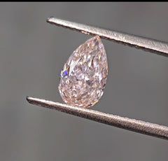 Fancy pink pear shaped diamond with subtle color, GIA certified.