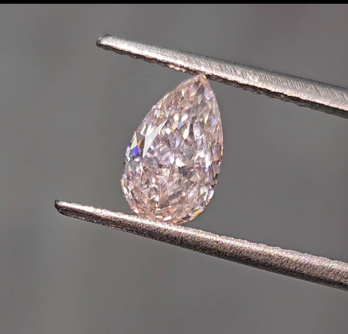 Fancy pink pear shaped diamond with subtle color, GIA certified.