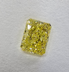 GIA certified Fancy Yellow marquise cut diamond with VS1 clarity and no fluorescence.