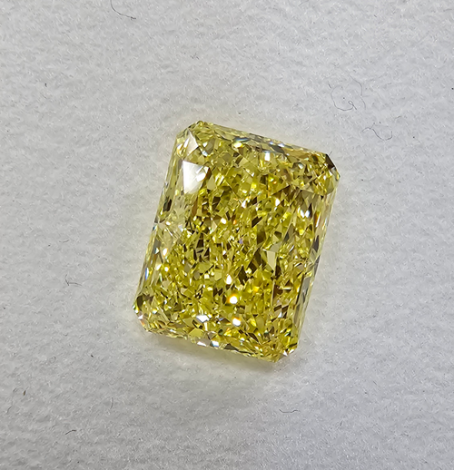 GIA certified Fancy Yellow marquise cut diamond with VS1 clarity and no fluorescence.