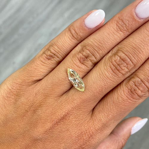 Fancy Yellow marquise cut diamond with VS1 clarity and no fluorescence.