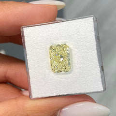 Elongated radiant yellow diamond, fancy light yellow natural diamond, natural canary diamond.