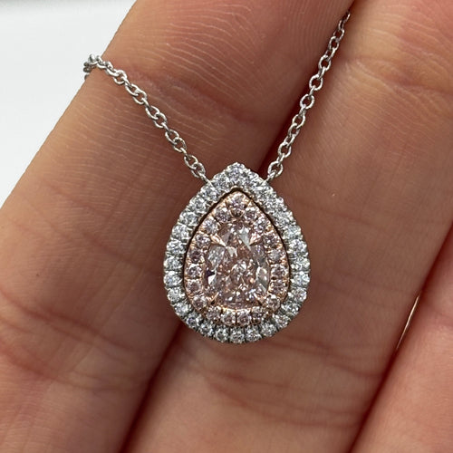 Ethereal pink pear-shaped diamond pendant with double halo featuring a GIA-certified faint pink center diamond with a VS2 clarity.