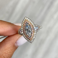 Fancy blue elongated diamond ring. blue marquis diamond. light blue diamond.