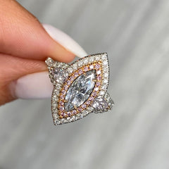 Fancy blue elongated diamond ring. blue marquis diamond. light blue diamond.