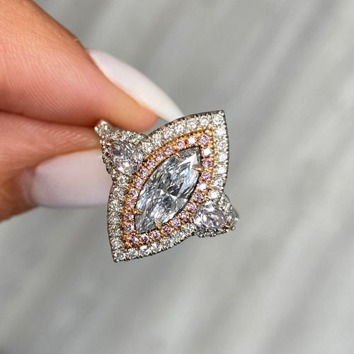 Fancy blue elongated diamond ring. blue marquis diamond. light blue diamond.