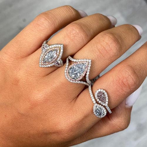 Fancy blue elongated diamond ring. blue marquis diamond. light blue diamond.