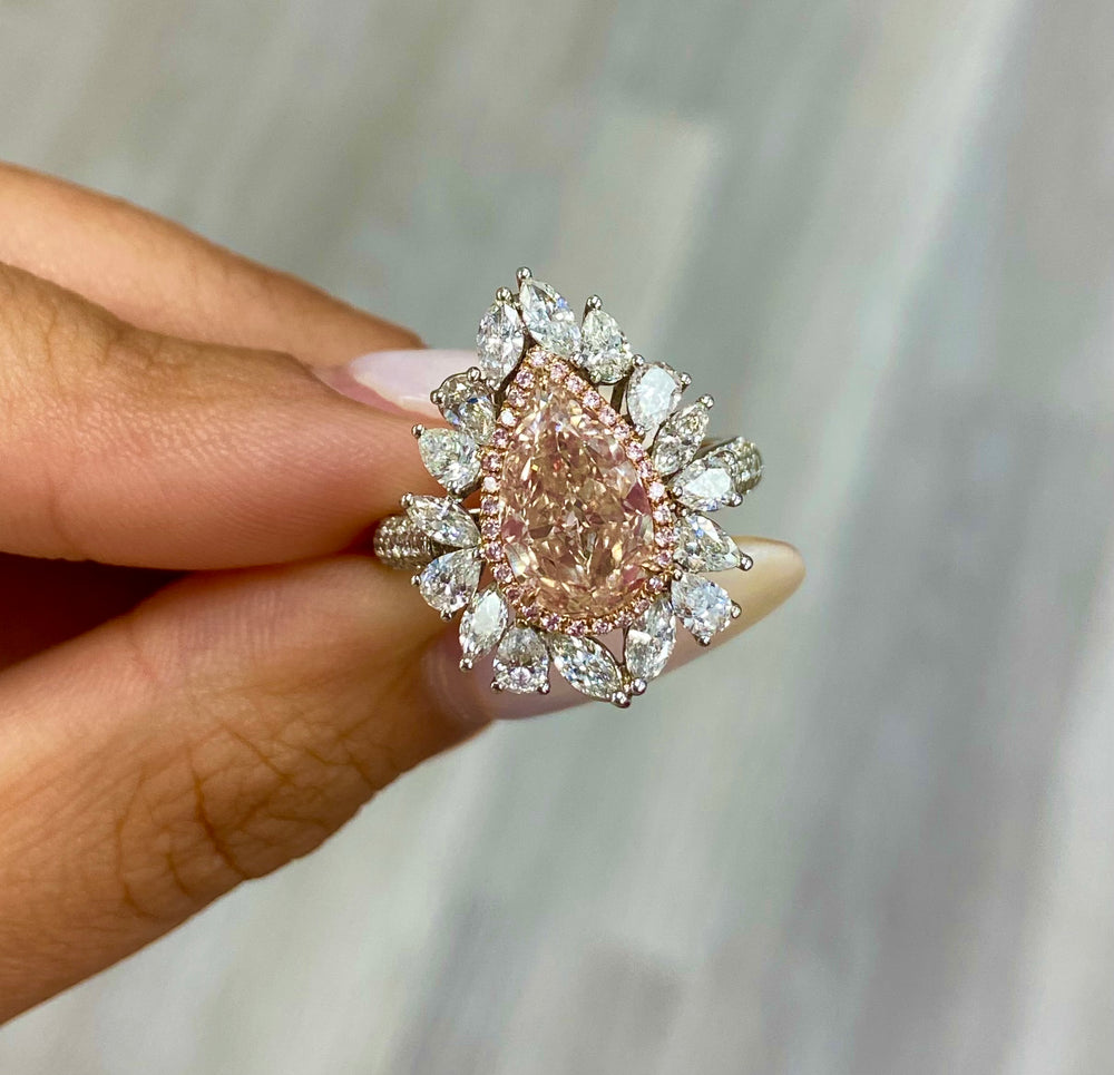 Unique peach color diamond ring, pear shaped, GIA certified. 
