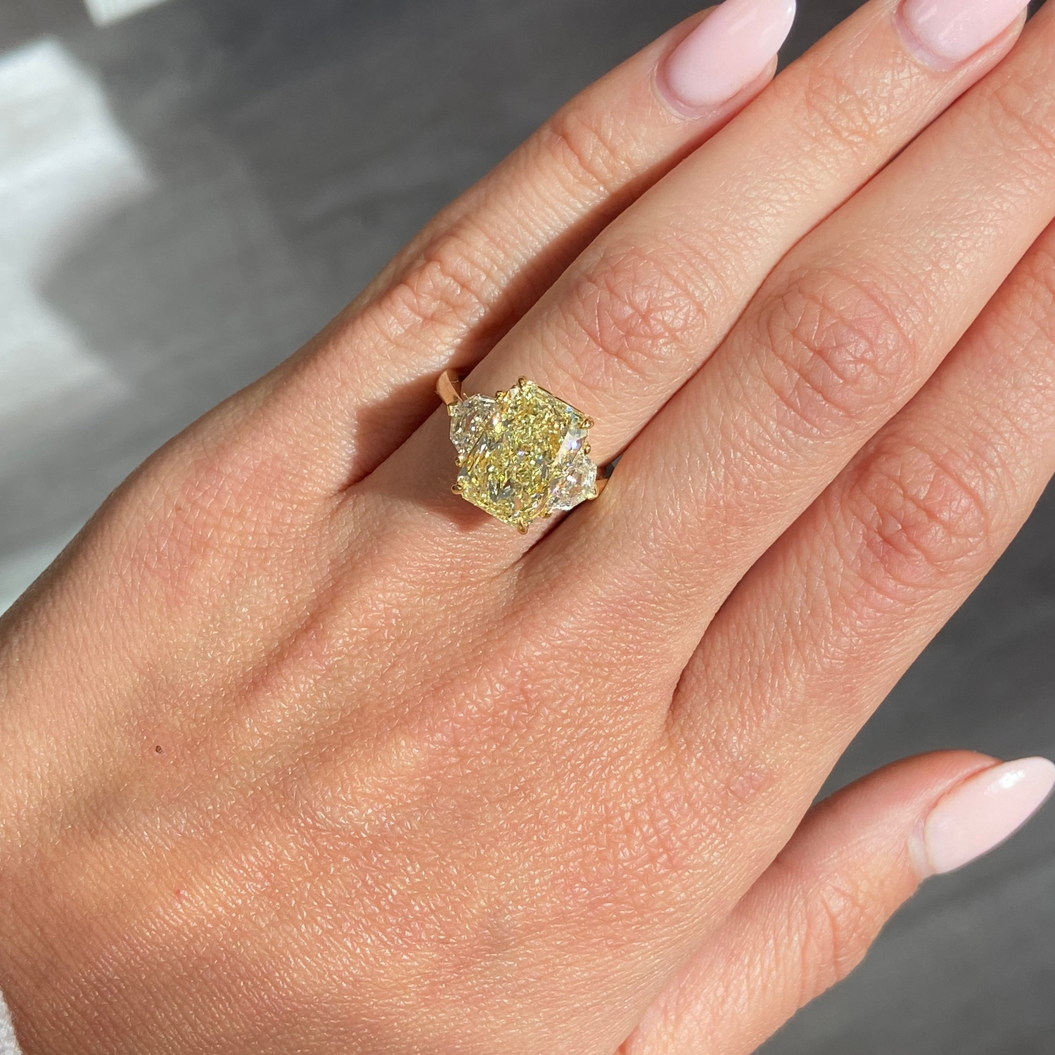 6.03ct Light Yellow Elongated Radiant Diamond Three Stone Ring