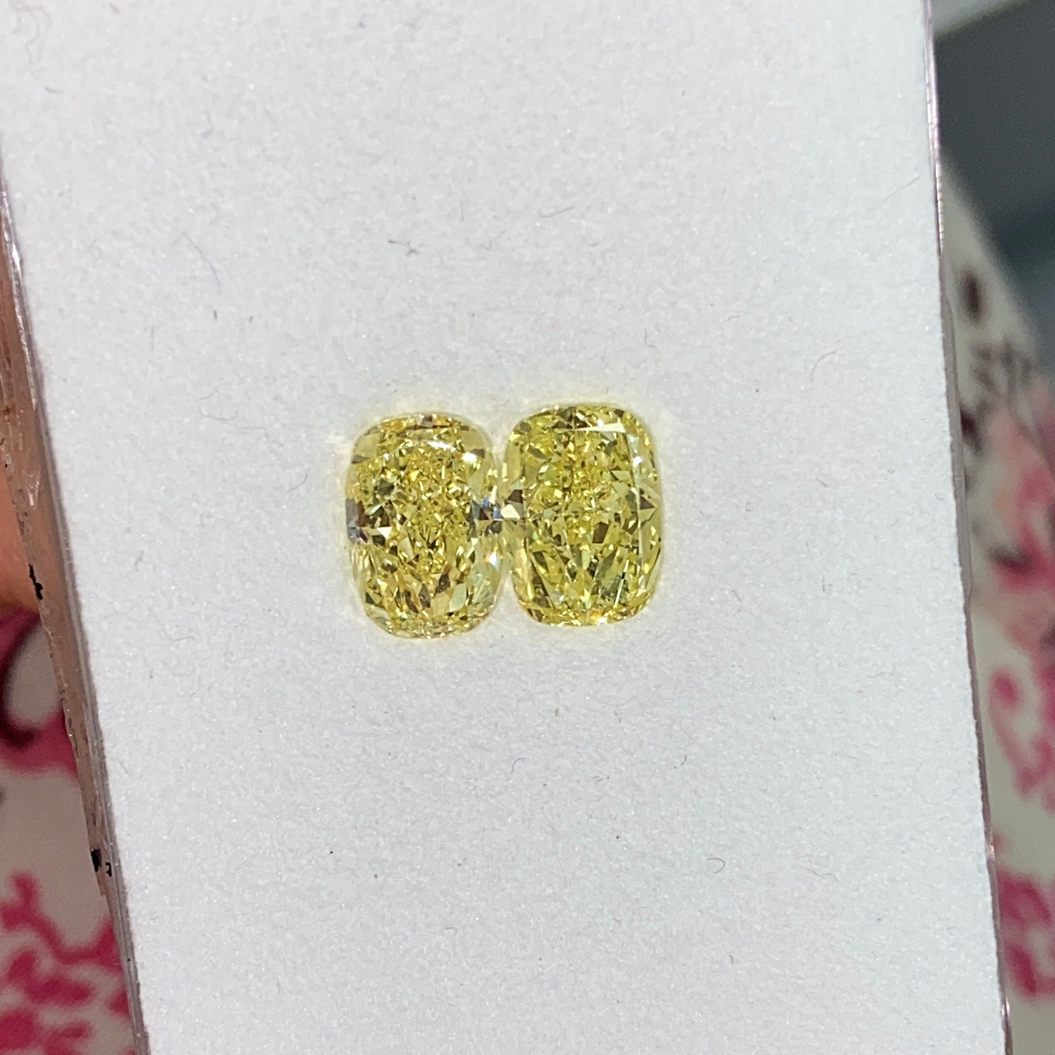 1.84ct and 1.80ct Fancy Intense Yellow Elongated Cushion Cut Diamonds