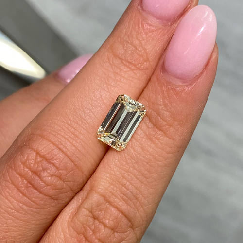 Unique elongated light yellow emerald cut diamond, GIA certified with excellent clarity.