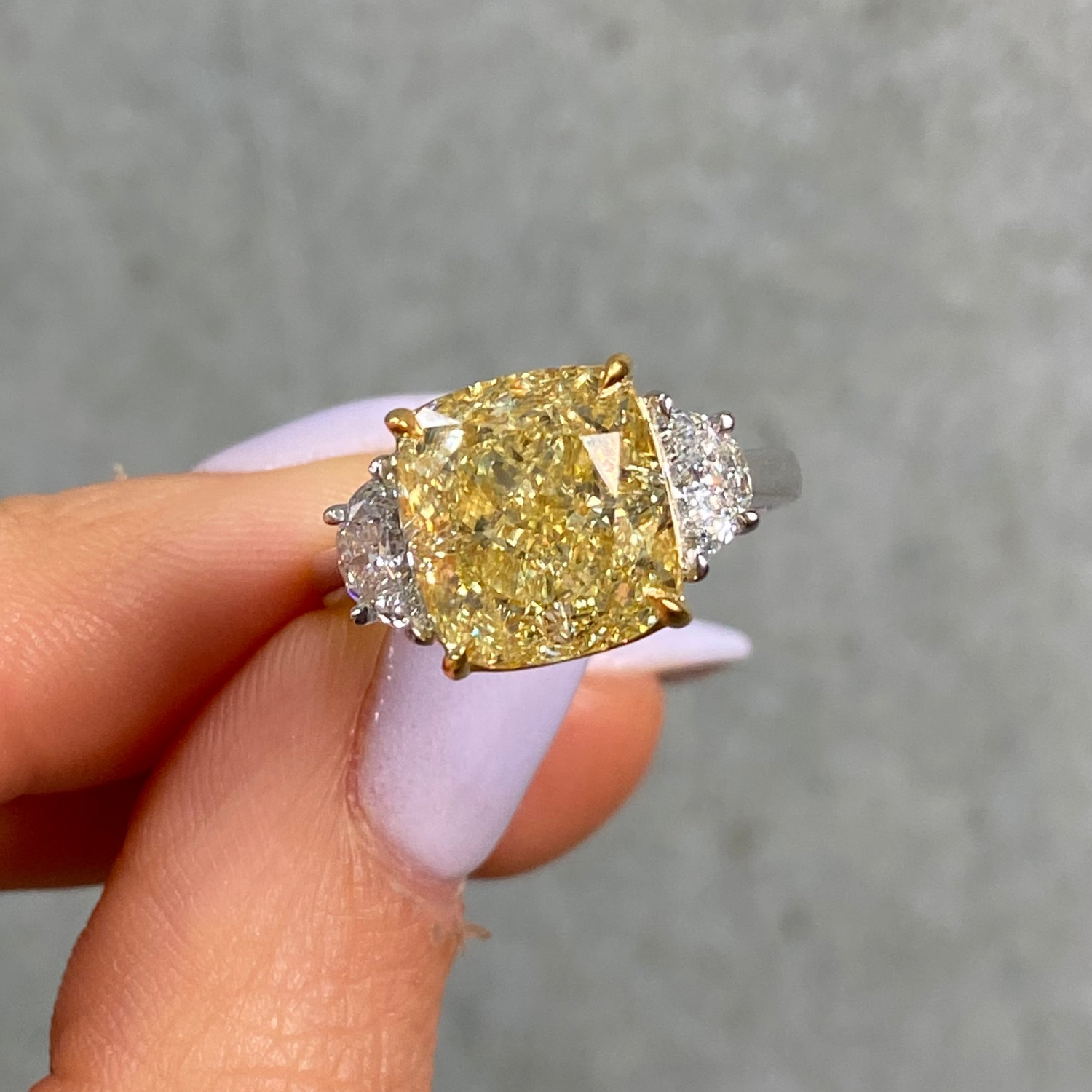 6.02ct Fancy Yellow Cushion three stone engagement ring — color diamond specialists Rare Colors by Namdar