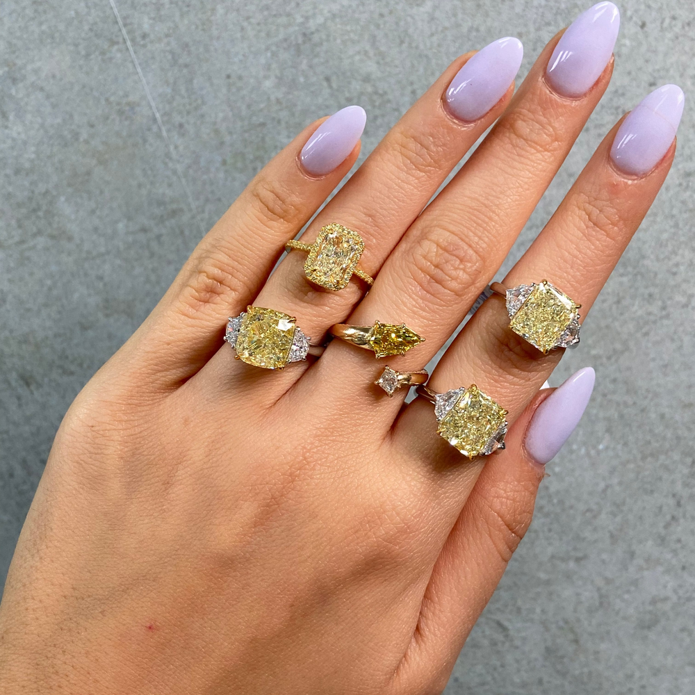 6.02ct Fancy Yellow Cushion diamond three stone engagement ring, handcrafted by Rare Colors by Namdar