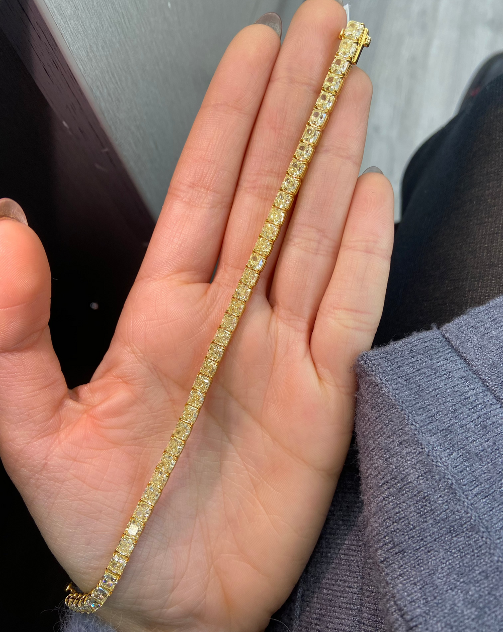 Fancy yellow diamond bracelet. Cushion diamond bracelet. Cushion tennis bracelet. Yellow diamond jewelry. Yellow tennis bracelet. Natural yellow diamonds.