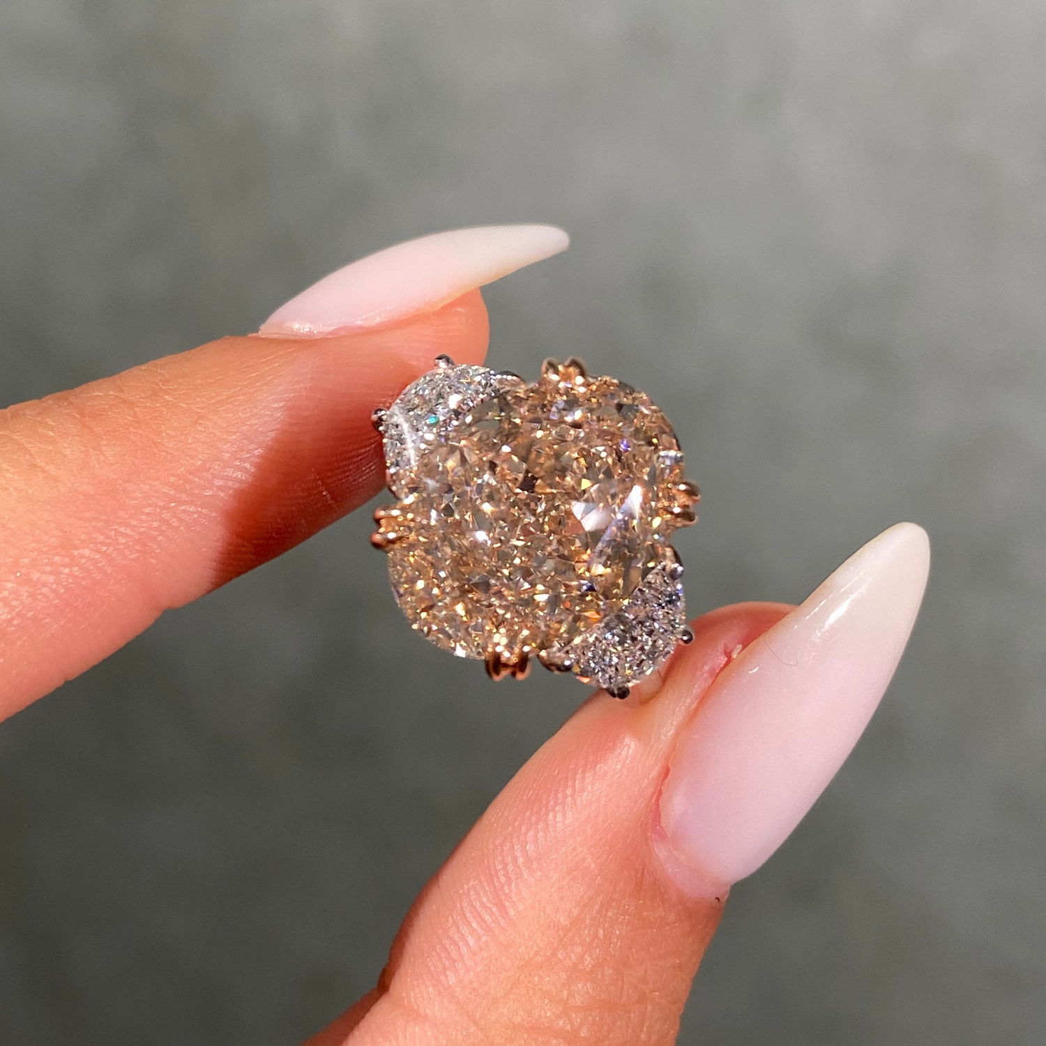 10ct champagne oval diamond three stone engagement ring with colorless side stones - close-up detail | Rare Colors by Namdar, NYC