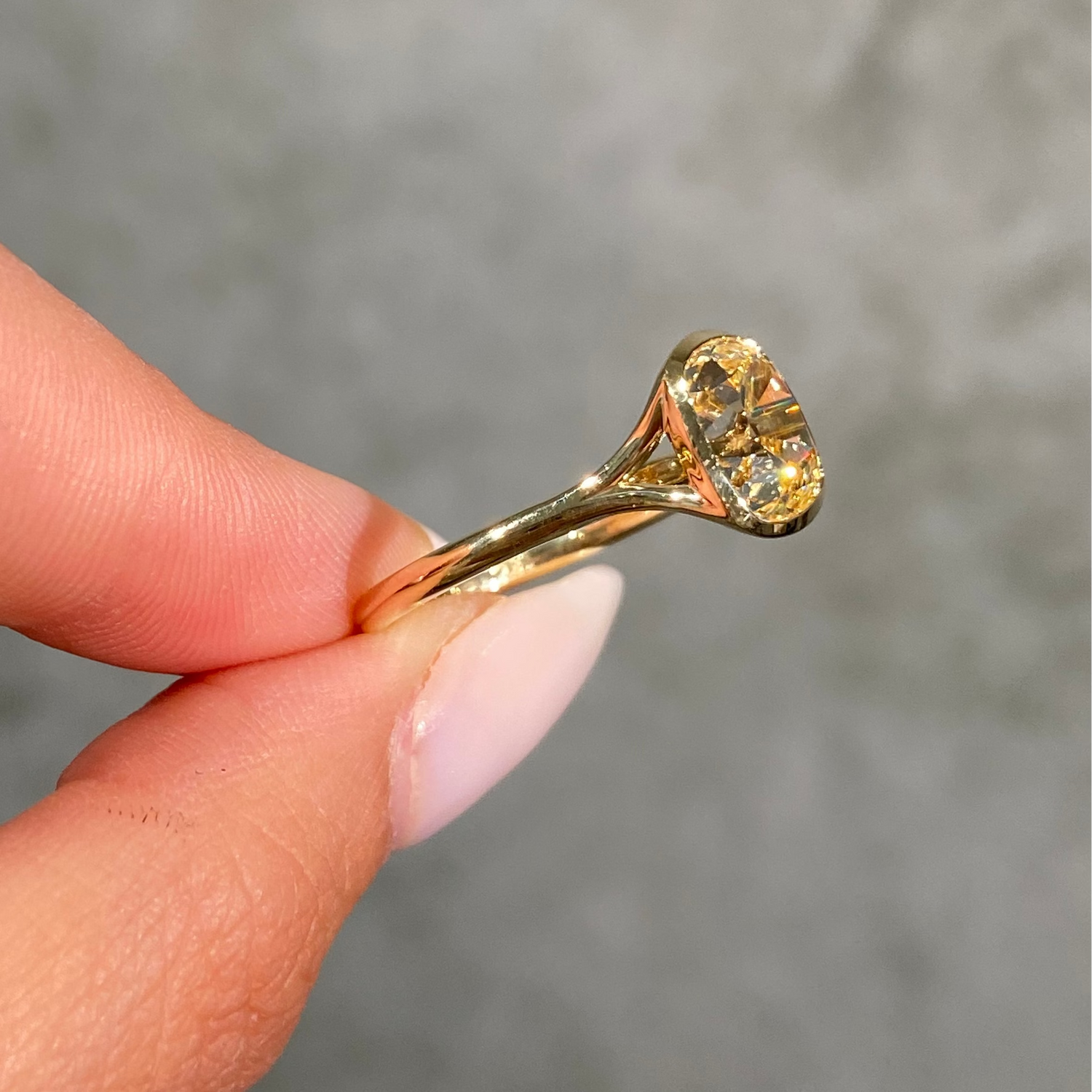2.7ct light yellow old mine cushion diamond split shank bezel solitaire engagement ring - close-up detail | Rare Colors by Namdar, NYC