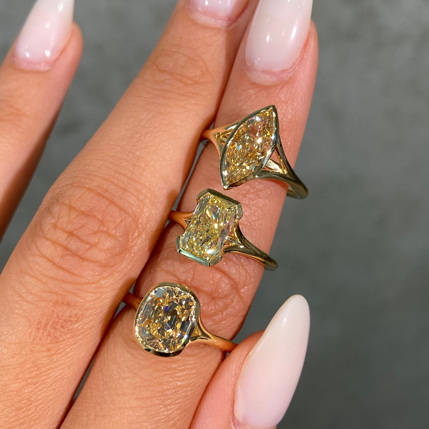 Light yellow diamond split shank bezel solitaire engagement rings - styled view | Rare Colors by Namdar, NYC