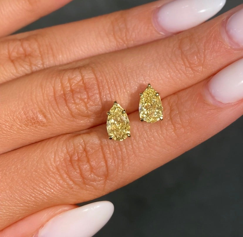 1ct each GIA fancy yellow pear diamond stud earrings - close-up detail | Rare Colors by Namdar, NYC