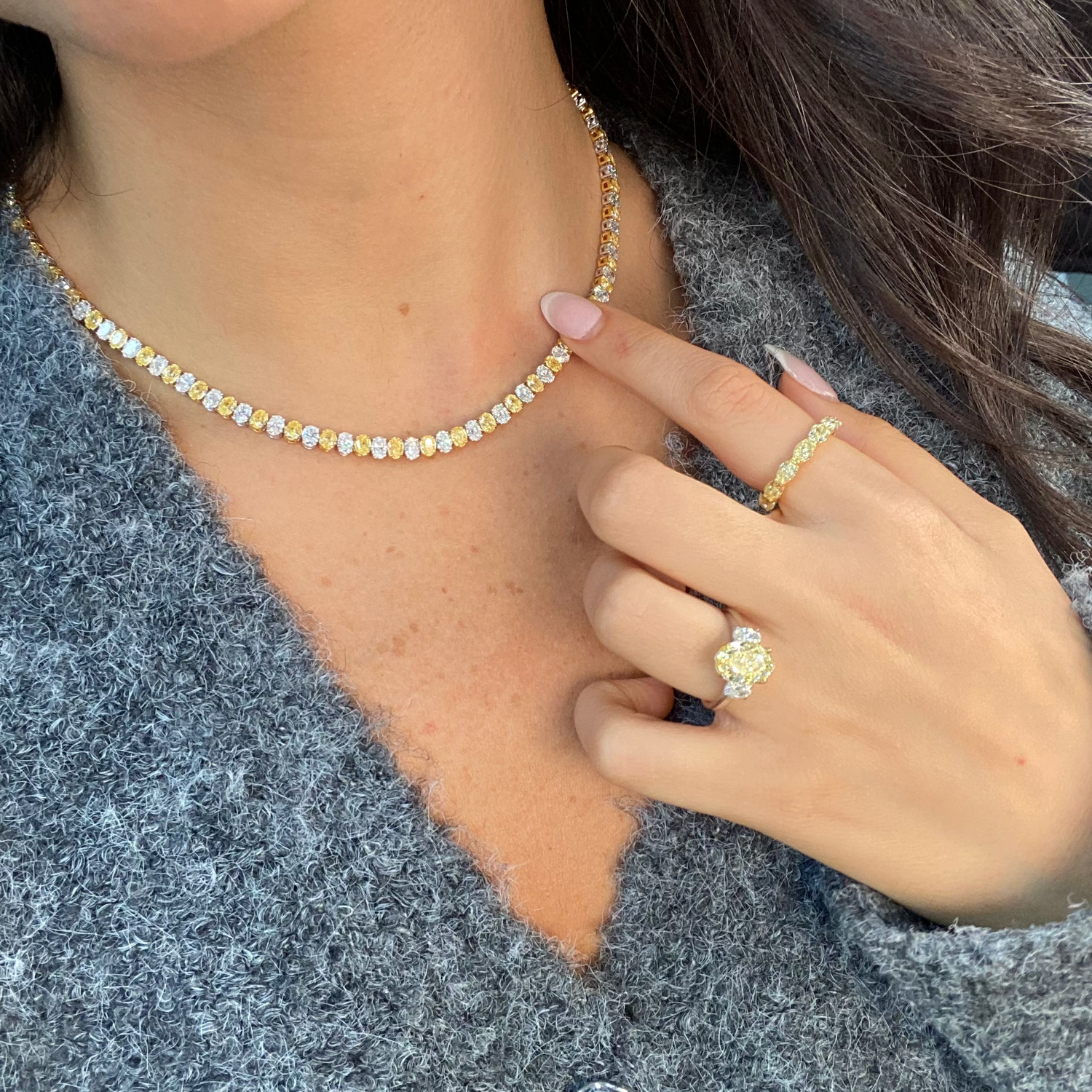 Yellow diamond oval diamond wedding band 
