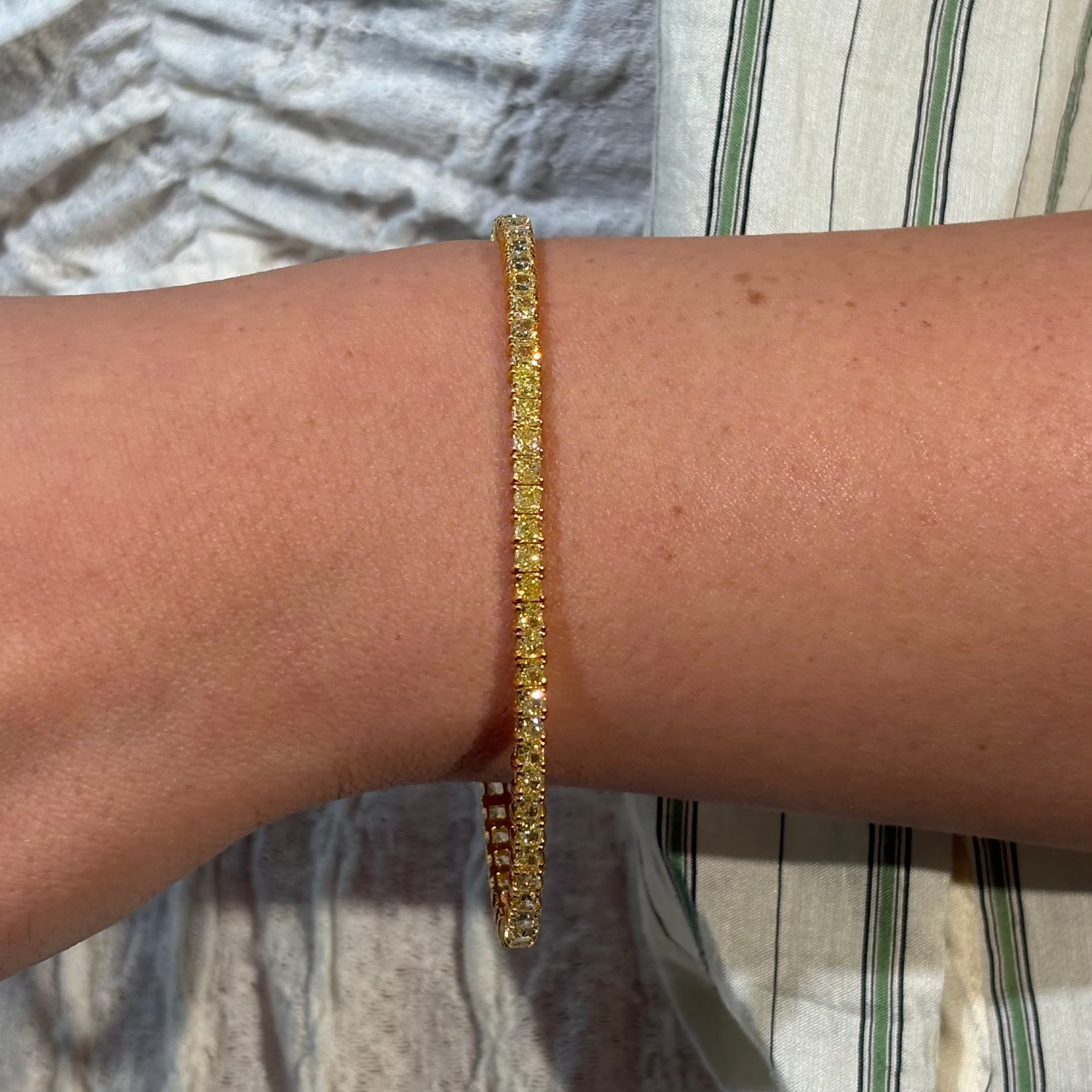 Fancy Yellow Cushion diamond tennis bracelet, handcrafted by Rare Colors by Namdar