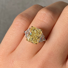 fancy light yellow ring with epaulettes on hand 