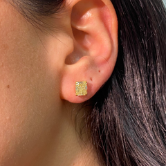 GIA certified fancy yellow diamond studs on ear