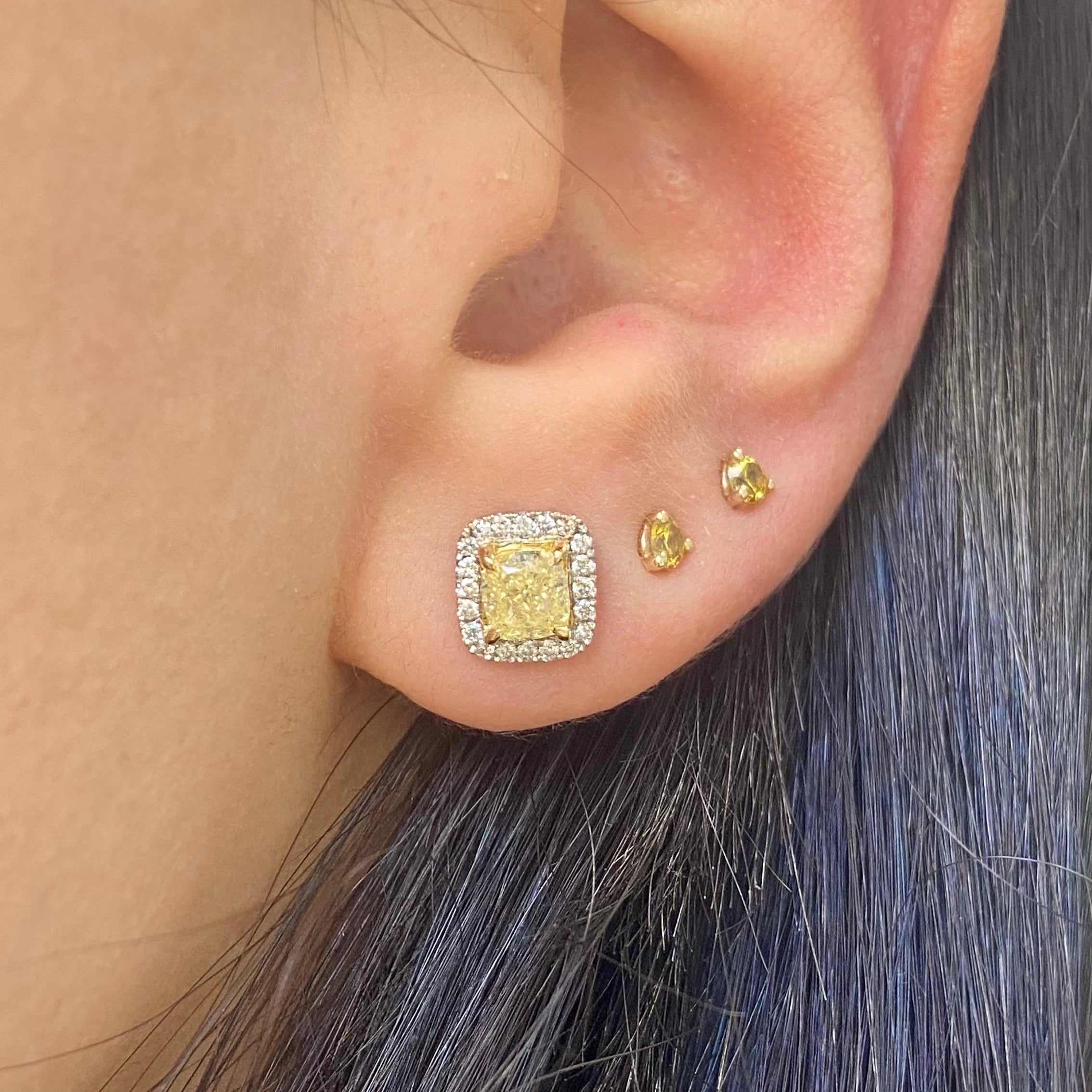 Fancy Light Yellow Cushion Diamond Studs 1.42 carat total center diamonds  Center diamonds are 0.71ct each  Surrounded by 0.22 Carats of White Radiant Diamonds Set in 18k Gold Handmade in NYC 